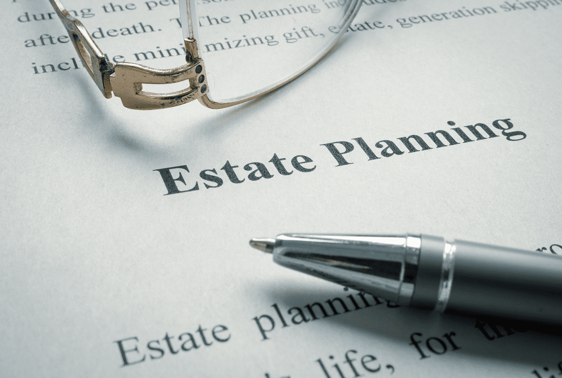 Close-up of estate planning text and pen