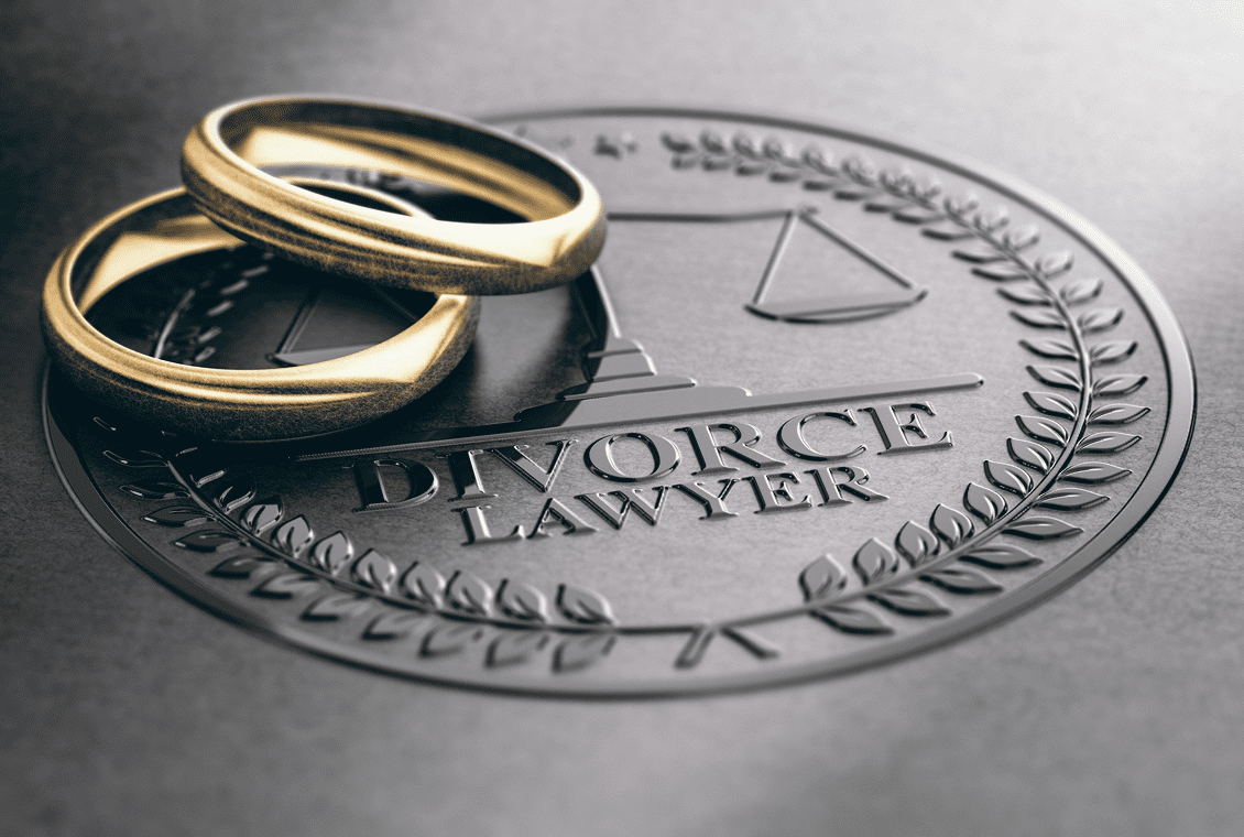 Wedding rings on divorce lawyer emblem