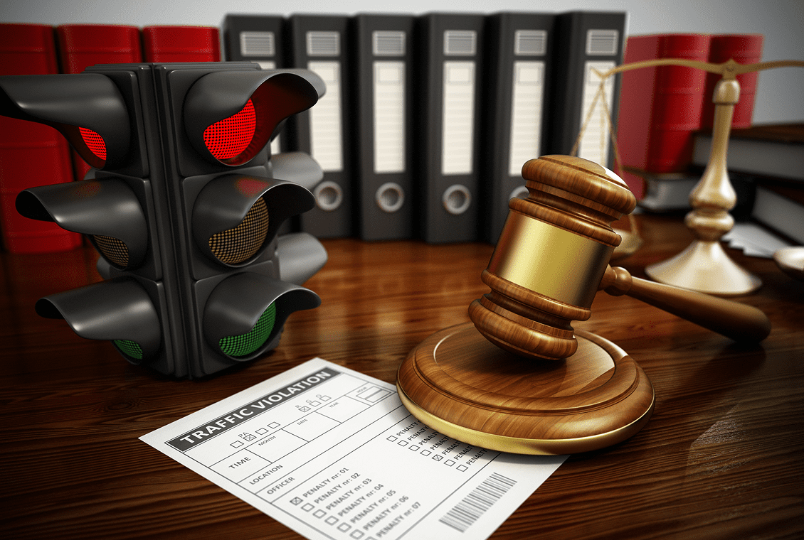 Traffic light and legal documents on desk